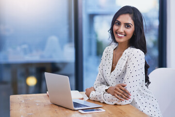 Business, portrait and Indian woman with a laptop, startup success or planning for a project, connection or development. Face, female employee or entrepreneur with technology, modern office or growth