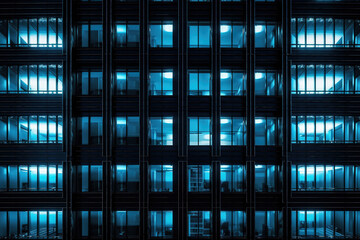 Seamless skyscraper facade with blue tinted windows and blinds at night. Modern abstract office building background texture with glowing lights against dark black exterior walls. Generative AI