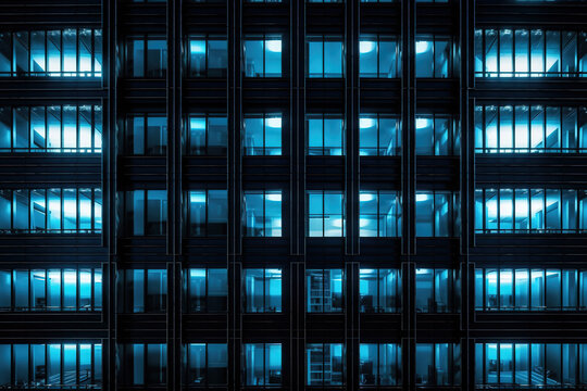 Seamless Skyscraper Facade With Blue Tinted Windows And Blinds At Night. Modern Abstract Office Building Background Texture With Glowing Lights Against Dark Black Exterior Walls. Generative AI