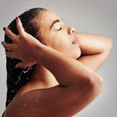 Shower, washing hair and face of woman with water in studio for wellness, cleaning and grooming....