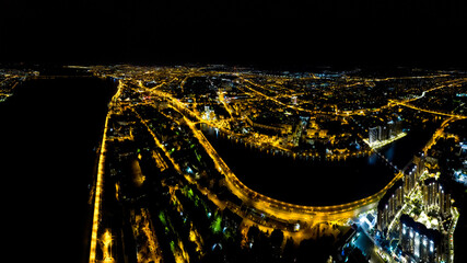 Astrakhan, Russia. Panorama of the city from the air. Night city lights. Aerial view