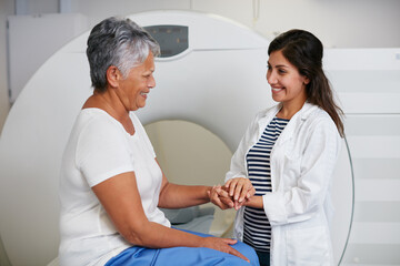 Doctor, ct scan and woman holding hands of patient in hospital before scanning in machine. Mri, comfort and happy medical professional with senior female person before radiology test for healthcare. - obrazy, fototapety, plakaty