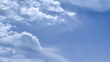 Obraz premium Blue sky with fluffy cloud. Beautiful sky in the morning. The concept of the freedom of life, never give up and new life beginning.