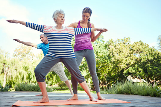Nature, elderly people and yoga coach, woman or personal trainer teaching exercise, outdoor workout or fitness. Instructor, wellness couple and old person learning pilates, training or health balance