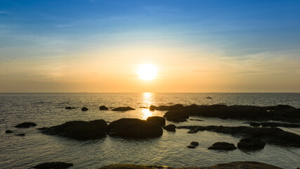 Sky view at sunset with ocher color over the sea, amazing view on the island.