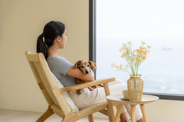 Woman enjoy the sea view outside window © leungchopan
