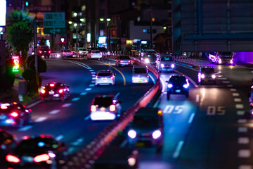 Fototapeta na wymiar A night miniature traffic jam at the city street