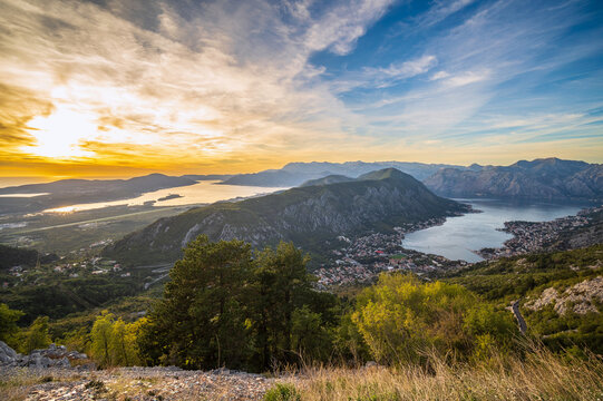 Bay of Kotor taken from mountain at early sunset with yellow and blue sky