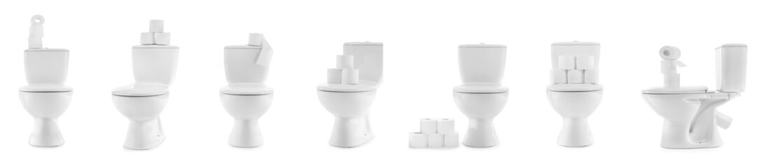 Set of toilet bowls and rolls of paper on white background