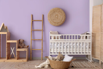 Interior of children's room with crib, ladder and shelves