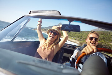 Car road trip, travel and happy couple on ocean holiday adventure, transportation journey or fun summer vacation. Love bond, convertible automobile and driver driving on Australia countryside tour - obrazy, fototapety, plakaty
