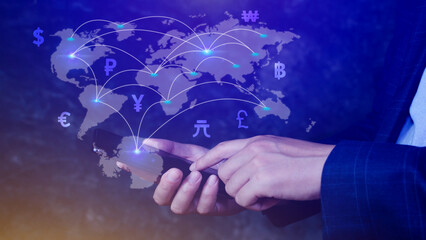 Businessman using mobile phone and laptop computer to money transfers and currency exchanges between countries of the world, online banking interbank payment concept.