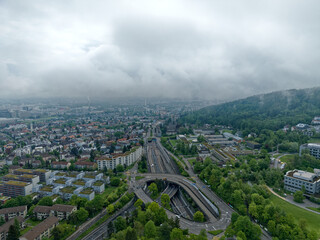 Obraz premium Aerial view of City of Zürich north on a cloudy spring morning seen from public park named Irchel with cloudy sky background. Photo taken May 9th, 2023, Zurich, Switzerland.