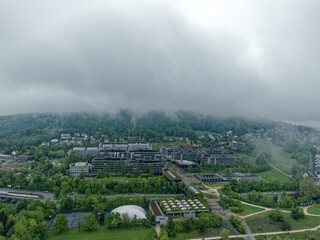 Aerial view of University of Zürich Campus Irchel with public park in the foreground on a cloudy spring morning at City of Zürich. Photo taken May 9th, 2023, Zurich, Switzerland.