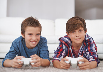 Boys playing video game, friends and gaming at home in smile portrait for fun together in living...