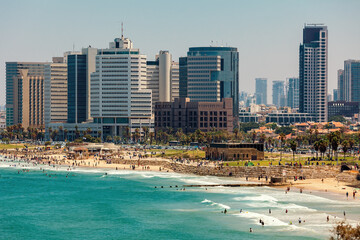 Fototapeta na wymiar Modern buildings and promenade along Mediterranean sea in Tel Aviv, Israel.