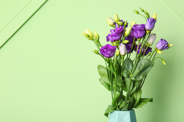 Naklejka na ściany i meble Eustoma flowers on green background