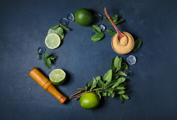 Frame made of ingredients for preparing mojito on dark background