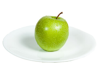 Green Apple with water drops on white plate