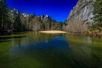 Fototapeta na wymiar Merced river full after snow melt in the Yosemite National Park, California, USA
