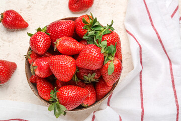 Bowl of fresh strawberries on white background