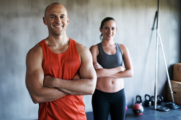 Happy people, fitness and portrait of personal trainer with arms crossed in confidence for workout, exercise or training at gym. Strong, fit and confident man and woman ready for exercising class