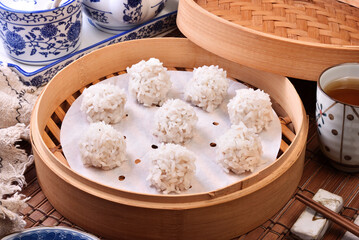 Glutinous rice meatballs in the bamboo steamer 