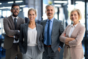 Group portrait of a professional business team looking confidently at camera.