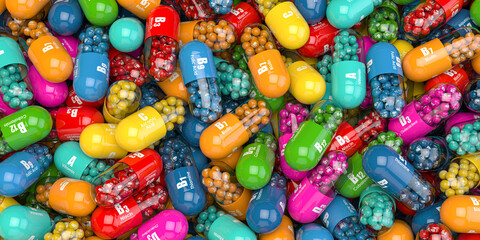 Pile of various vitamin capsules. Dietary and nutritional supplemets for healthy eating.