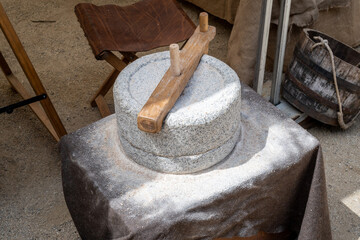 Old hand mill or jaw stone, grinds grain into flour. Old handmade grinding stones. Grinding flour...