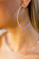 Chic women's earrings with stones, jewelry, earrings at the ear of a beautiful girl, women's accessories, gold earrings, earrings with stones.