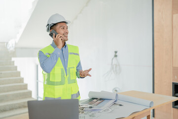 Fototapeta premium multi ethnic engineer brainstorming and measuring for cost estimating on blueprint and floor plan drawings about design architectural and engineering for houses and buildings