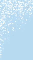 Naklejka na ściany i meble Snowy christmas background. Subtle flying snow flakes and stars on light blue winter backdrop. Delicate sweet snowy christmas. Vertical vector illustration.