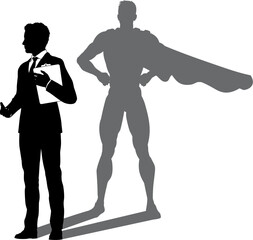 A superhero business man revealed by his shadow silhouette as a super hero in a cape