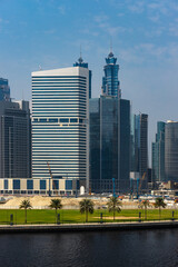 Obraz premium View at the Dubai downtown skyscrapers. UAE modern architecture. Development of the Dubai downtown business district. Modern buildings in UAE. 