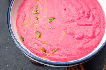 beet cream soup beetroot beets, leeks, potatoe first course healthy meal food snack on the table copy space food background rustic top view