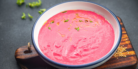 beet cream soup beetroot beets, leeks, potatoe first course healthy meal food snack on the table copy space food background rustic top view