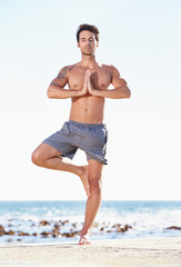 Fitness, man and yoga in meditation on beach for exercise, spiritual wellness or inner peace in...