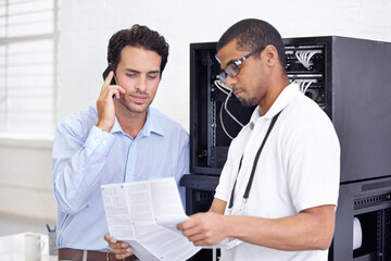 Server room, it support and phone call with a man technician reading about cyber security...