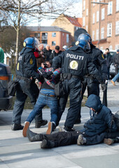 Police men, criminal and arrest in the city of Denmark for street safety, security or law enforcement. Group of legal government officers arresting people in a urban town for crime, justice or riot