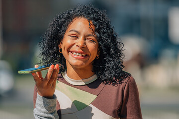 urban girl on the street with mobile phone