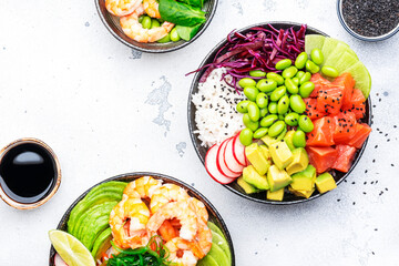 Poke bowl set: tuna, salmon, shrimps with avocado, fruits and vegetables, white rice and other...