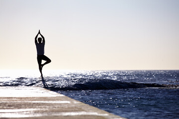 Man, silhouette and yoga in meditation on ocean at beach for spiritual wellness, inner peace or mental wellbeing space. Male yogi in tree pose for balance, healthy body or mindfulness on sea mockup