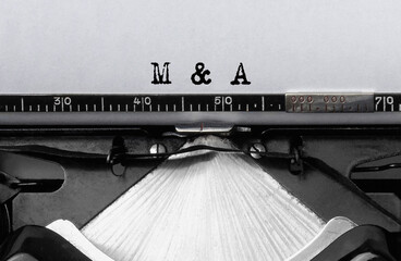 Text M and a typed on retro typewriter