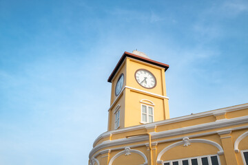 Yellow clock tower and building in Sino-Portuguese architectural style