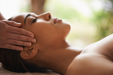 Woman, hands or head massage to relax in spa for zen resting, sleeping wellness or luxury physical...