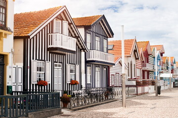 Houses With Colorful Stripes On Street In Costa Nova, Portugal