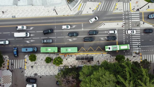 Bus Stop Aerial Shoot.Traffic in the city. Bus going in the bus line