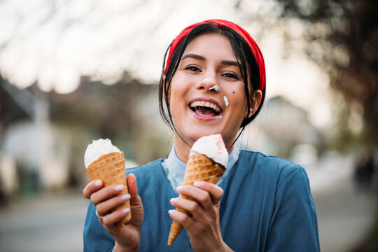 Hand of woman holding ice cream in waffle cone
