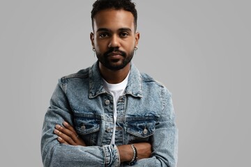 Handsome young african american guy posing in studio - isolated